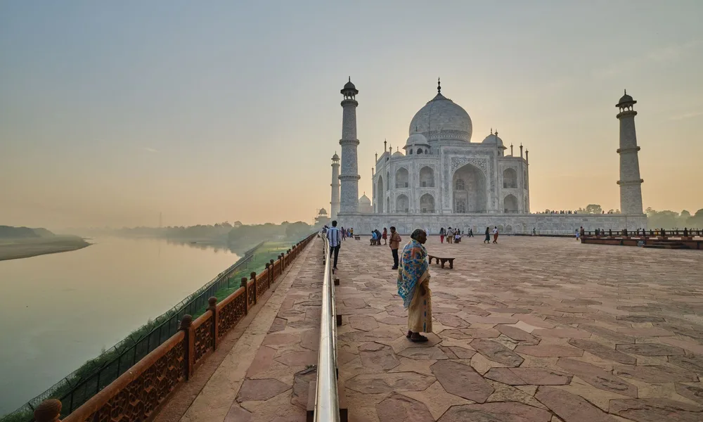 The Taj Mahal at sunrise, on the banks of the Yamuna River