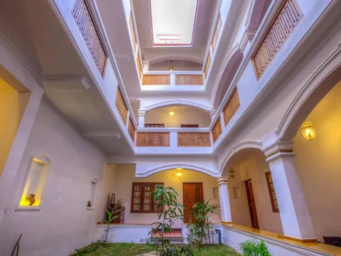 Hall and staircase of The Fort Bungalow in Kerala