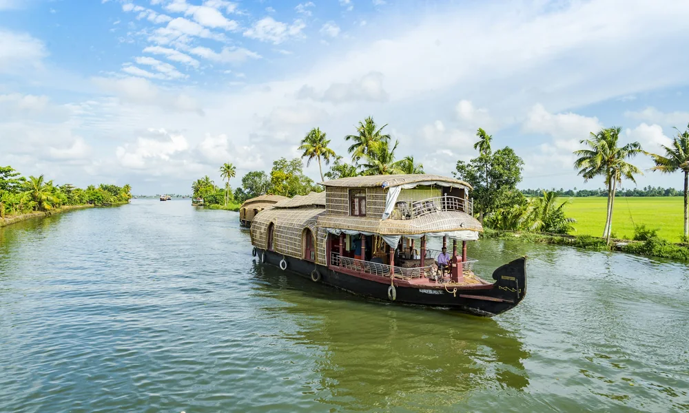 A houseboat sailing through the Alleppey backwaters