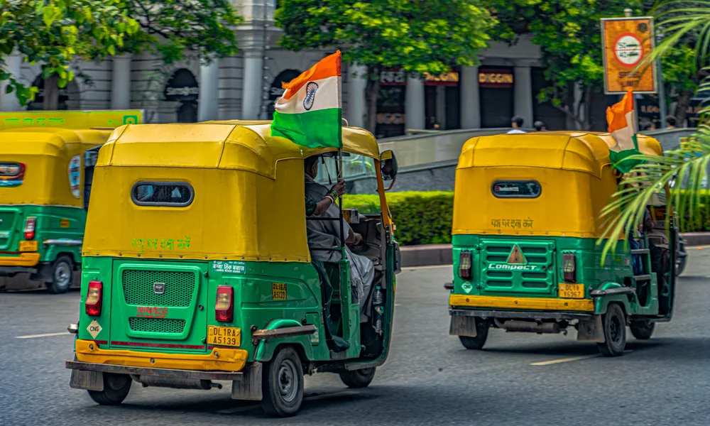 Tuk-tuks with Indian flags in Connaught Place, New Delhi