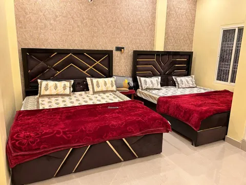 Room with two beds of Temple Town Homes in Varanasi