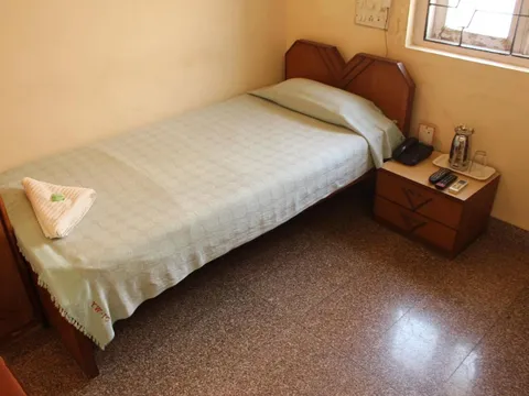 Room with two beds of YWCA International Centre in Mumbai